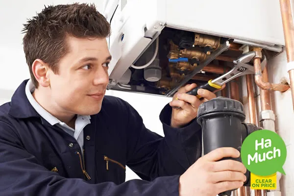 heating engineer servicing a combi boiler