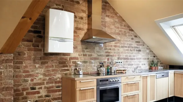 new combi boiler installed in a kitchen on a brick wall